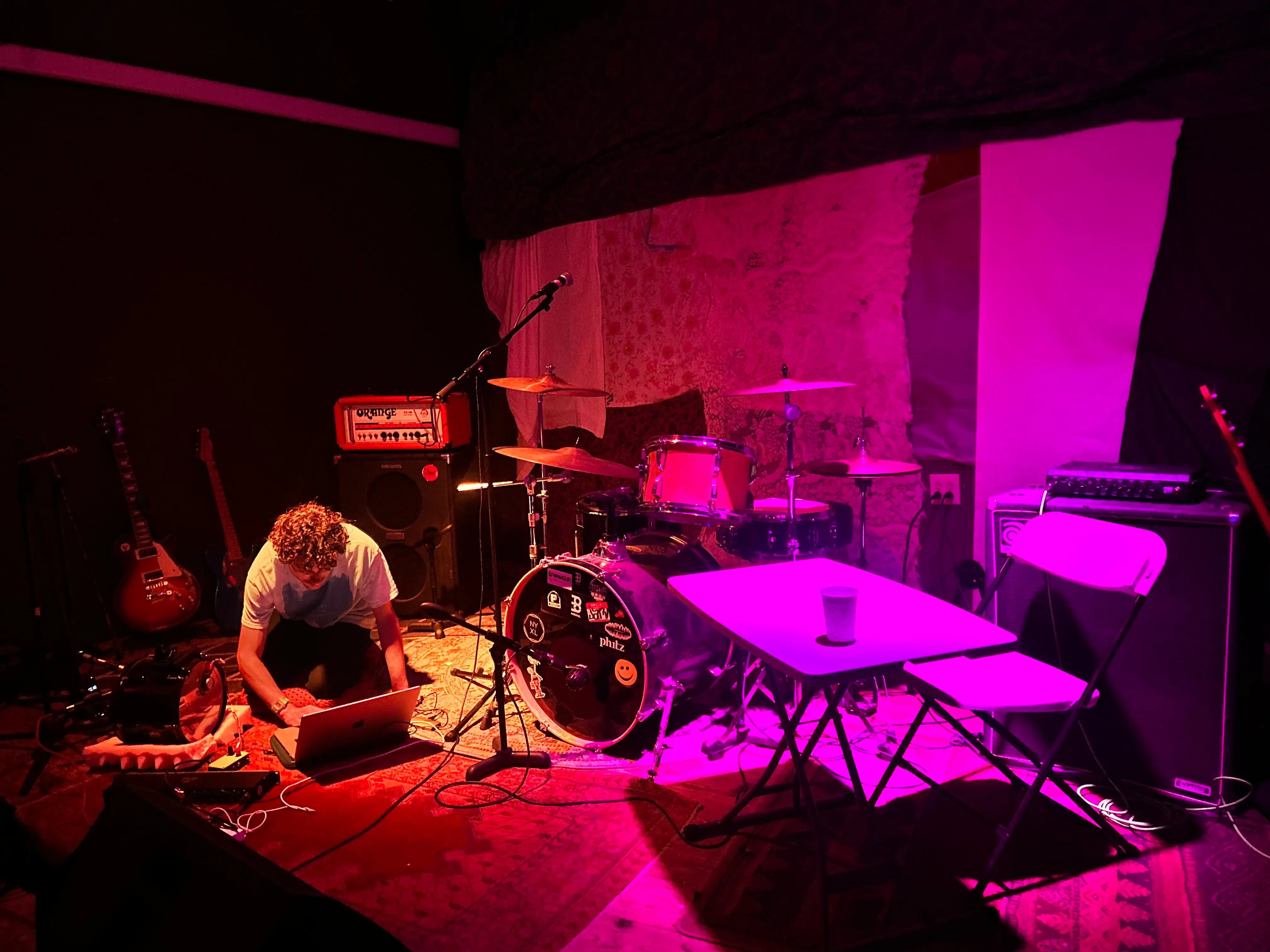 a table and a laptop on the floor